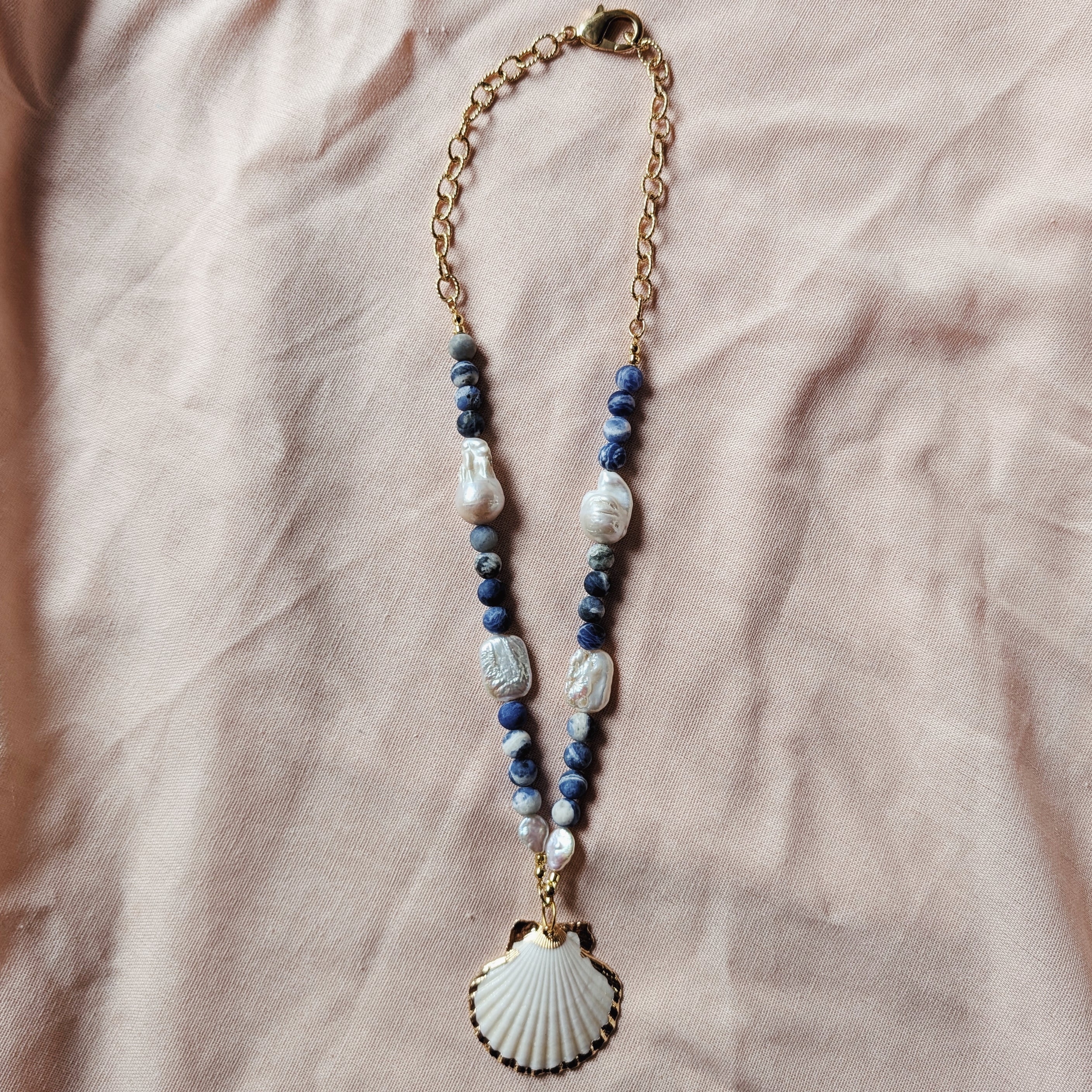 The Solenne Necklace | Sodalite, Baroque Pearl & Gilded Tiger Paw Shell