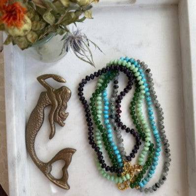 The Callahan hand-knotted gemstone necklace from Wild Alabaster — upcycled silk strand with gold clasp, featuring Chrysoprase, Amethyst, Labradorite, Jade, or African Turquoise.