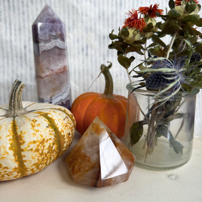 Large golden healer diamond crystal—gold-hued quartz gemstone reflecting natural light, used for energy healing and grounding rituals.